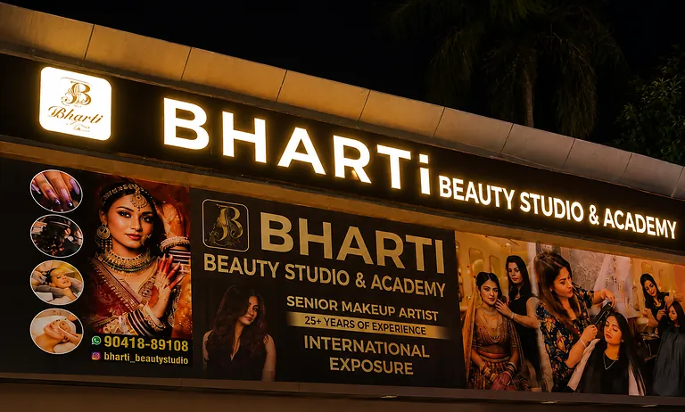 The illuminated Bharti Beauty Studio & Academy sign above the first-floor entrance.