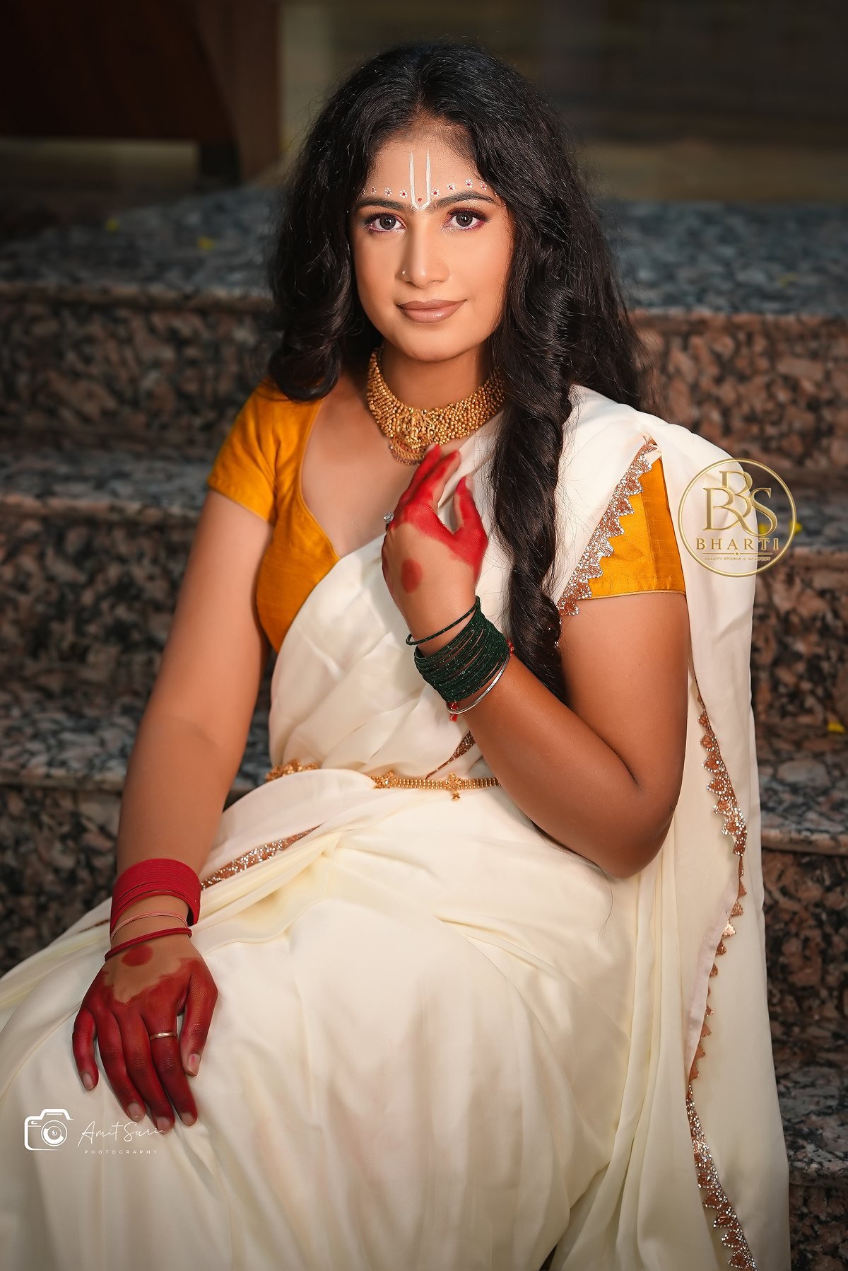 Radha editorial styling: a model in ivory and yellow with floral jewellery.